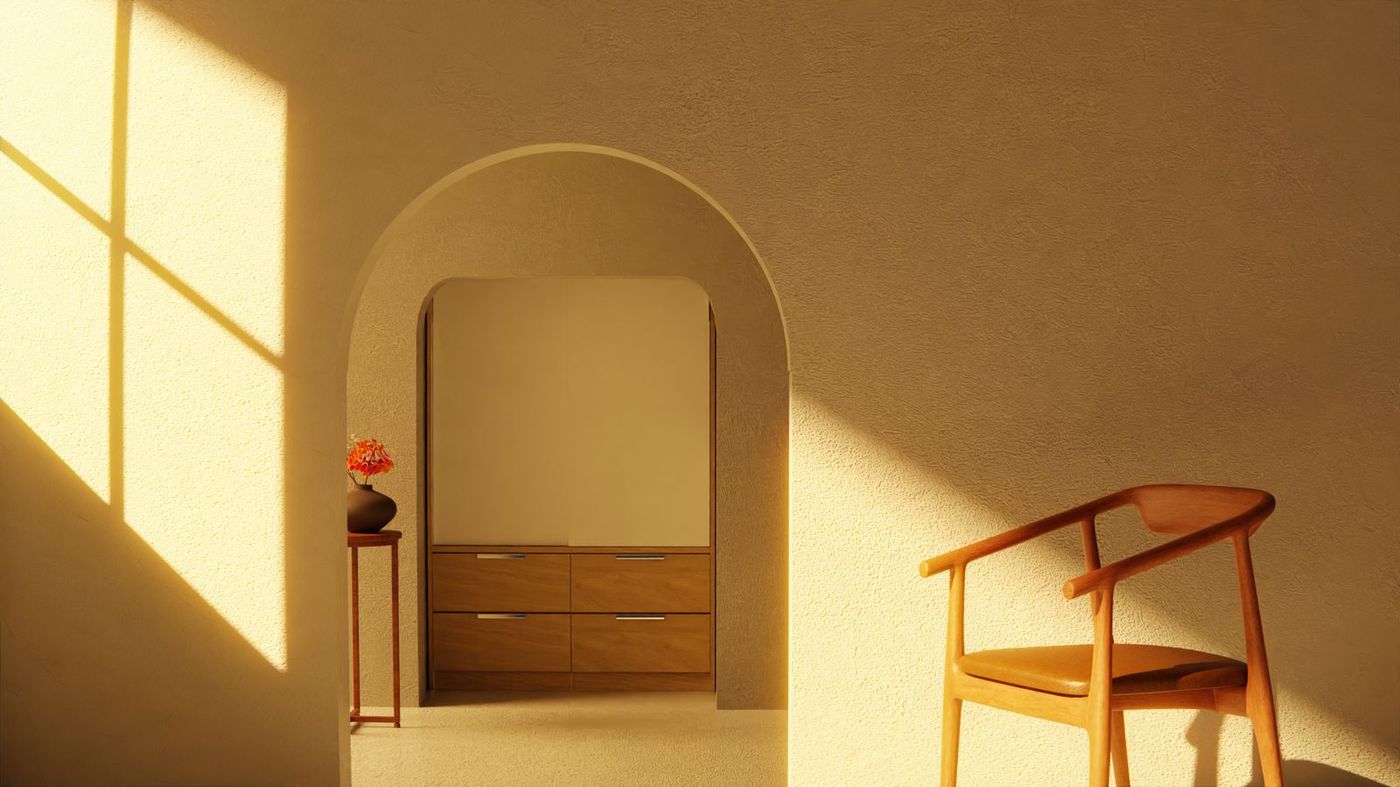 A quiet arched living room in afternoon light